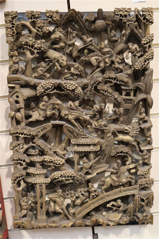 Four Chinese carved giltwood panels of battle scenes